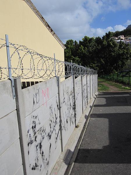 Notice the Michael Jackson tribute under this barbed wire lined wall in the Muslim district.